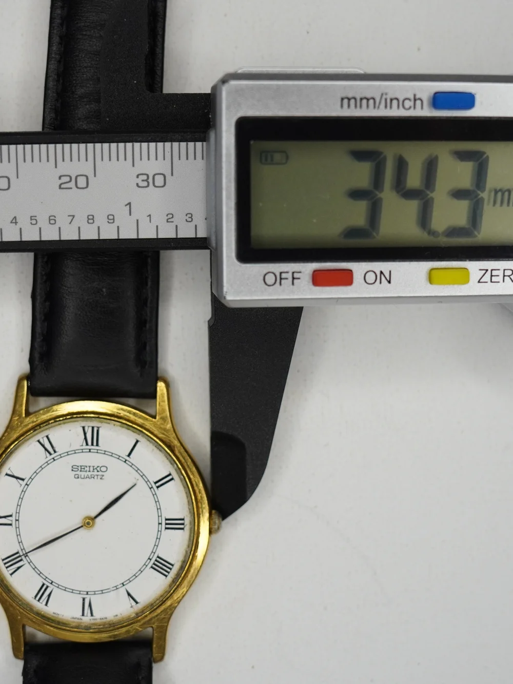 Vintage Seiko 1990s V700-8A10 Quartz Gold-Tone White Dial Roman Numerals Watch